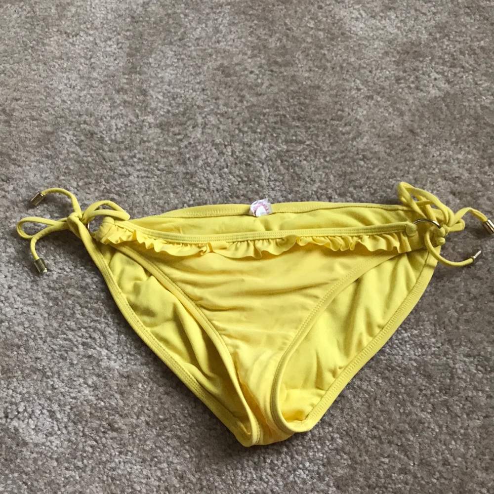 Yellow bathing suit bottoms with ruffle on front